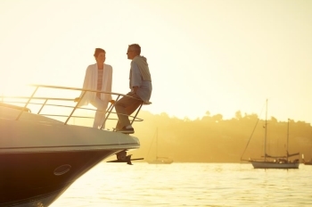 couple on boat at sunset